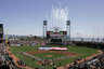Fireworks explode from center field of AT&T Park as the San Francisco Giants, left, and San Diego Padres, right, line up on opening day before their baseball game in San Francisco, Monday, April 7, 2008. (AP Photo/Eric Risberg)