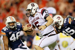 AUBURN AL - SEPTEMBER 25:  Quarterback Stephen Garcia #5 of the South Carolina Gamecocks rushes upfield against Craig Stevens #46 and Antoine Carter #45 of the Auburn Tigers at Jordan-Hare Stadium on September 25 2010 in Auburn Alabama.  (Photo by Kevin C. Cox/Getty Images)