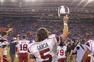 GAINESVILLE FL - NOVEMBER 13:  Stephen Garcia #5 of the South Carolina Gamecocks waves to fans after winning a game against the Florida Gators at Ben Hill Griffin Stadium on November 13 2010 in Gainesville Florida. The Gamecocks beat the Gators 36-14.  (Photo by Mike Ehrmann/Getty Images)