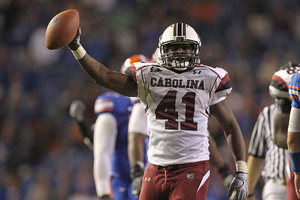 GAINESVILLE FL - NOVEMBER 13:  Josh Dickerson #41 of the South Carolina Gamecocks holds up the ball after recovering a fumble during a game against the Florida Gators at Ben Hill Griffin Stadium on November 13 2010 in Gainesville Florida.  (Photo by Mike Ehrmann/Getty Images)