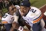 Auburn quarterback Cameron Newton (2) celebrates with teammate Nick Fairley (90) following a 28-27 win over Alabama in an NCAA college football game at Bryant-Denny Stadium in Tuscaloosa, Ala., Friday, Nov. 26, 2010. (AP Photo/Butch Dill)