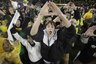 Oregon fans celebrate at the end of the Ducks' 48-29 win over Arizona. (AP Photo/Rick Bowmer)