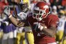 Arkansas running back Knile Davis (7) runs for a touchdown as he is pursued by LSU defensive end Barkevious Mingo during the first quarter of an NCAA college football game in Little Rock, Ark., Saturday, Nov. 27, 2010. (AP Photo/Danny Johnston)