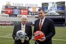Syracuse coach Doug Marrone, right, and Kansas State coach Bill Snyder pose for a portrait on the field at Yankee stadium in New York.  The two schools are scheduled to play in the the Pinstripe Bowl NCAA college football game on Thursday, Dec. 30, at the baseball stadium.(AP Photo/Mary Altaffer)