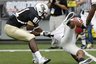 Central Florida wide receiver Kamar Aiken (81) brings down Georgia cornerback Branden Smith after Smith intercepted a pass in the first quarter of the Liberty Bowl NCAA college football game on Friday, Dec. 31, 2010 in Memphis, Tenn. (AP Photo/Mark Humphrey)